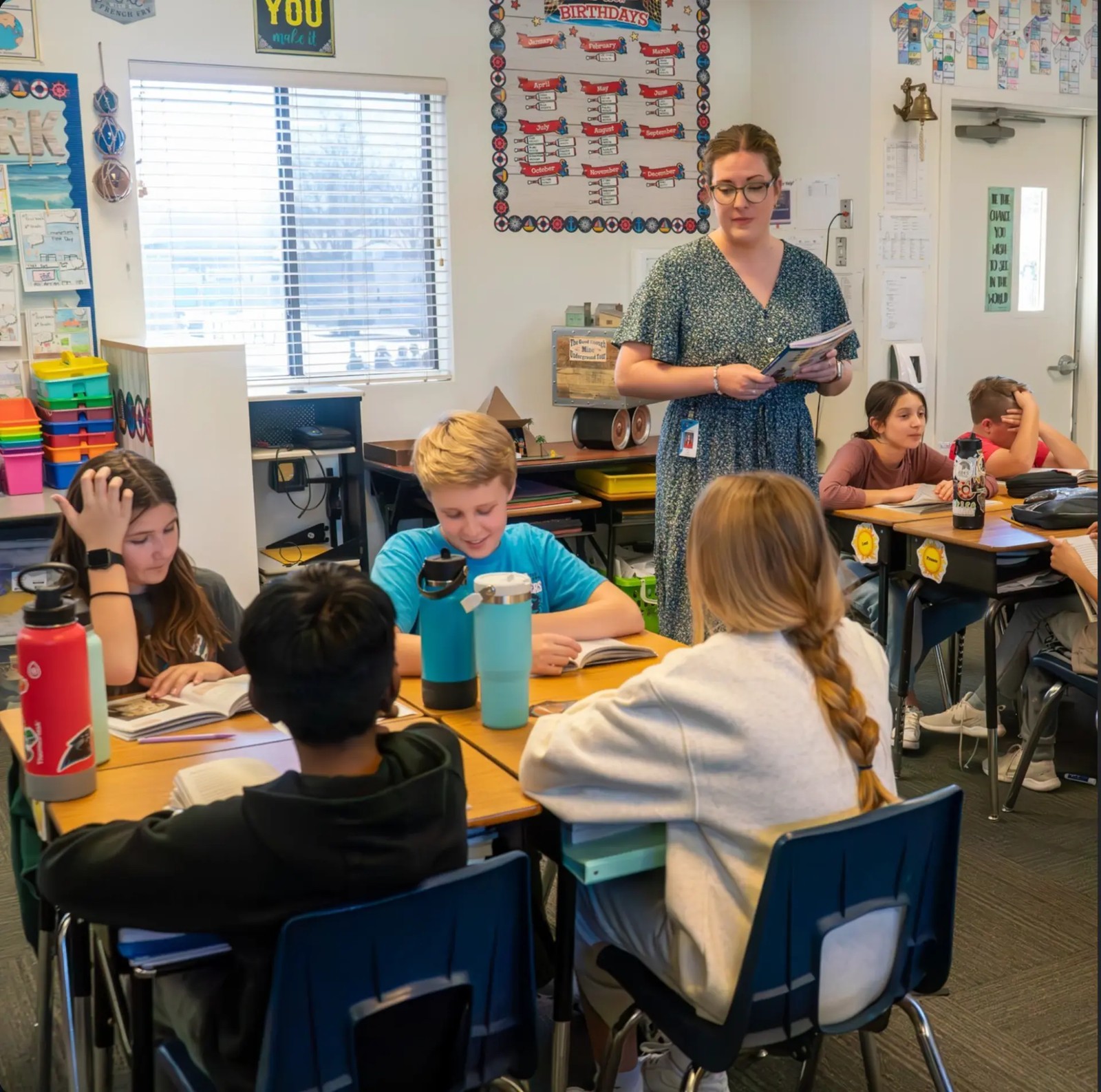 A Benchmark teacher guiding students through a classroom reading lesson