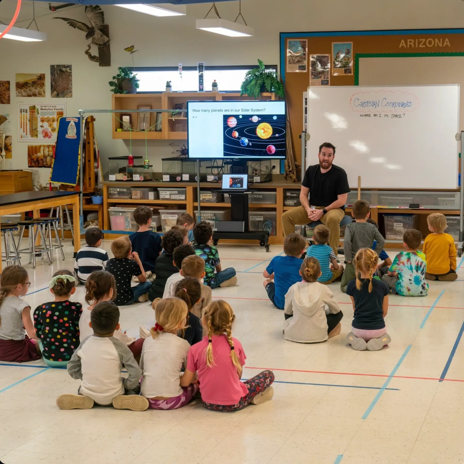 Benchmark students gathered for a solar system lesson in the Living Science Lab